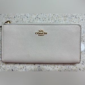 Coach leather wallet. Accordion style. Cream color. Mint condition, no marks.